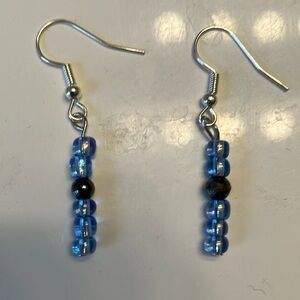Blue/purple iridescent beads with iridescent metal bead earrings.
